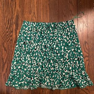 KELLY RUFFLE MINI SKIRT IN GREEN LEOPARD